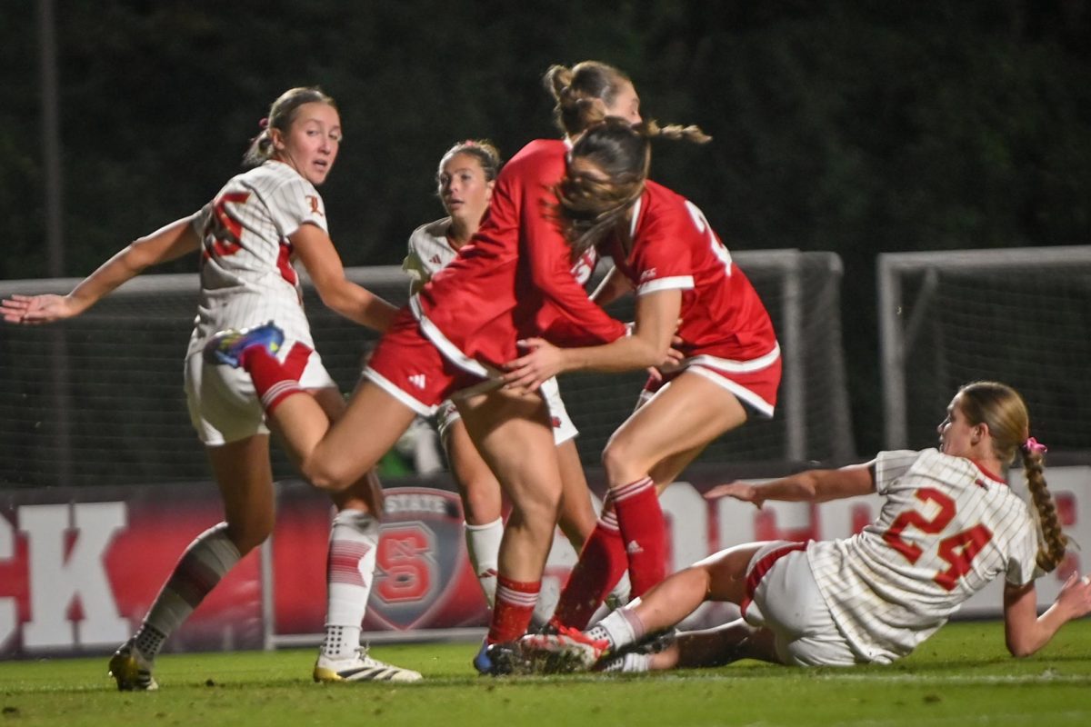 Junior forward Jade Bordeleau and junior midfielder Mary Frances Symmes collide during the game against Louisville at Dail Soccer Stadium on Thursday, Oct. 23, 2025. The Cardinals defeated the Wolfpack 3-0. 