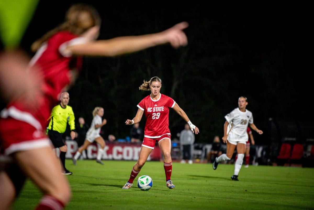 Sophomore midfielder Fien Leijdekker passes the ball ahead during the game against Wake Forest in Dail Soccer Stadium on Thursday, Oct. 2, 2025. Leijdekker had one assist. The Wolfpack defeated the Demon Deacons 2-1.