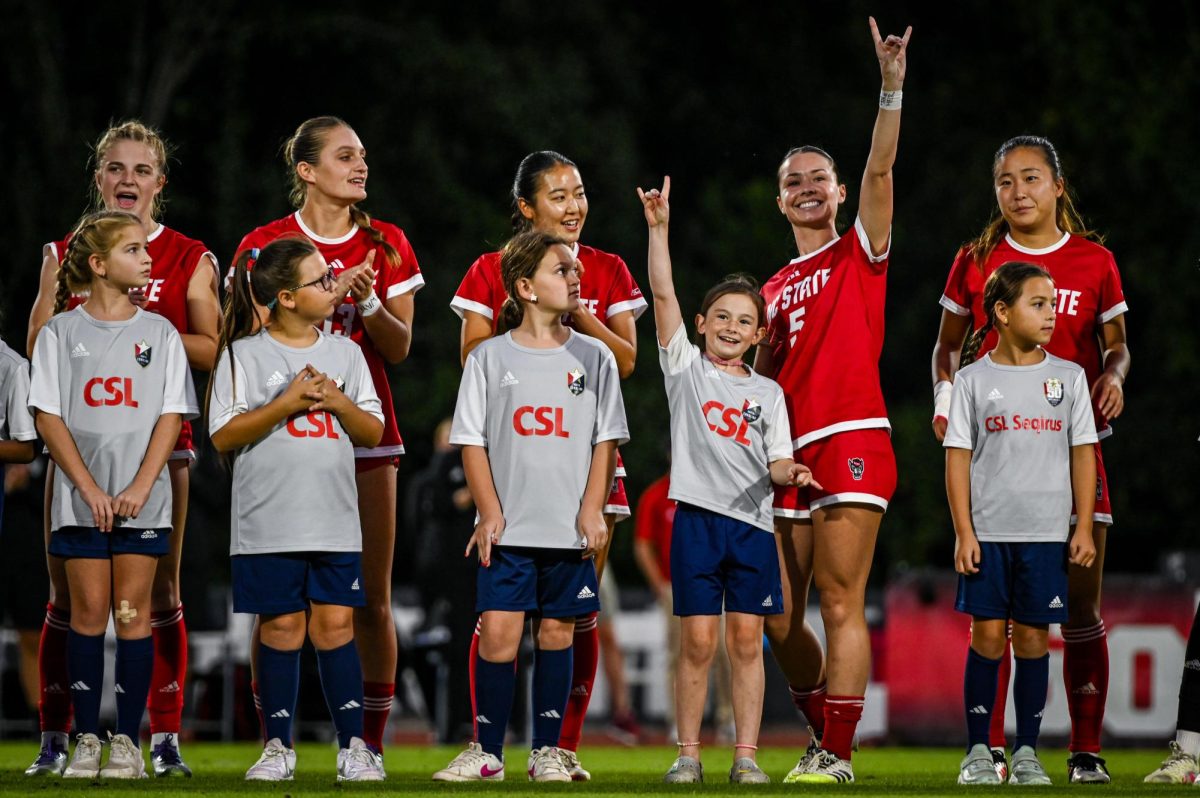 Senior defender Alex Mohr puts up "Wolfies" to the crowd before the game against Wake Forest in Dail Soccer Stadium on Thursday, Oct. 2, 2025. The Wolfpack defeated the Demon Deacons 2-1.