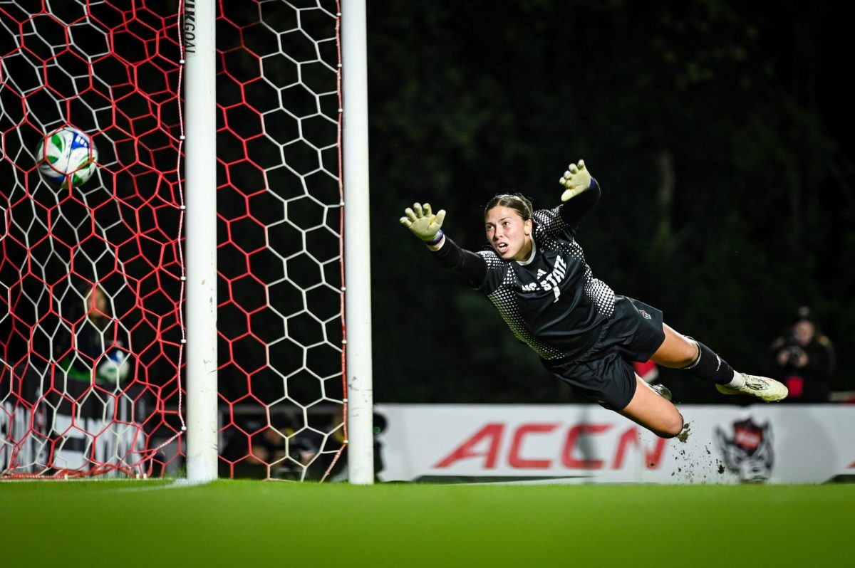 Senior goalkeeper Olivia Pratapas attempts to save the ball during the game against Wake Forest in Dail Soccer Stadium on Thursday, Oct. 2, 2025. Pratapas recorded eight saves. The Wolfpack defeated the Demon Deacons 2-1.