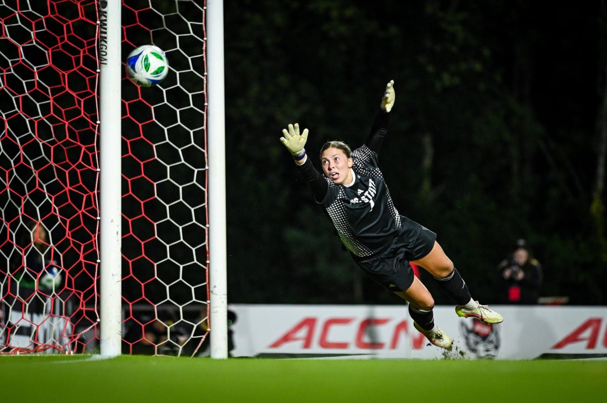 Senior goalkeeper Olivia Pratapas attempts to save the ball during the game against Wake Forest in Dail Soccer Stadium on Thursday, Oct. 2, 2025. Pratapas recorded eight saves. The Wolfpack defeated the Demon Deacons 2-1.