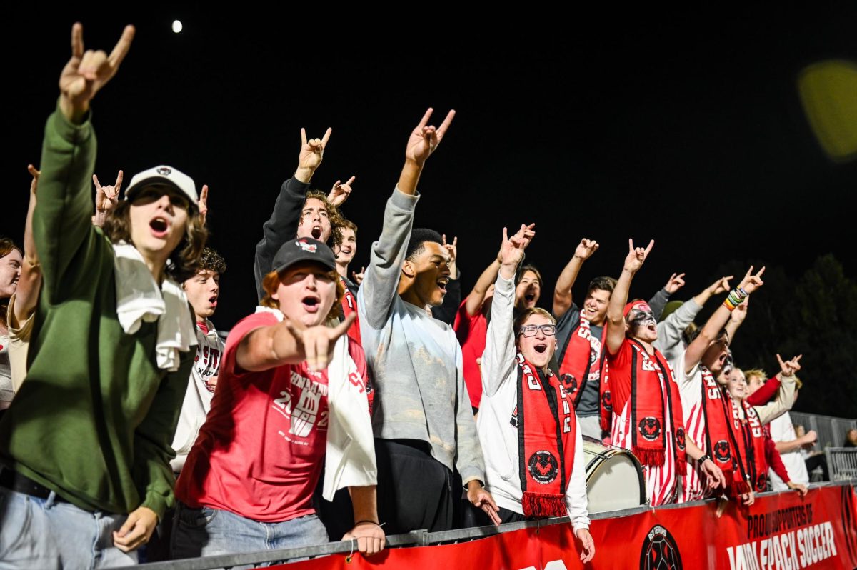 The Red Terrors throw up "Wolfies" during the game against Wake Forest in Dail Soccer Stadium on Thursday, Oct. 2, 2025. The Wolfpack defeated the Demon Deacons 2-1.