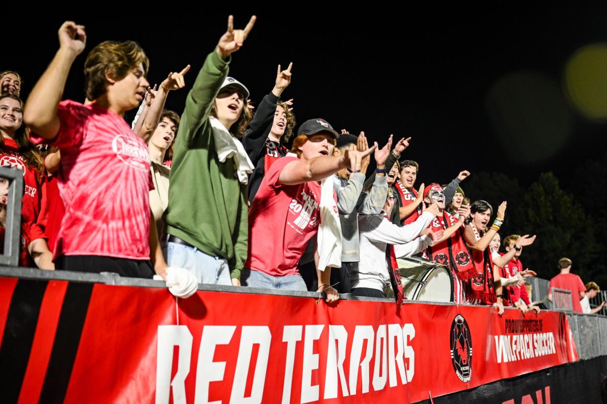 The Red Terrors throw up "Wolfies" during the game against Wake Forest in Dail Soccer Stadium on Thursday, Oct. 2, 2025. The Wolfpack defeated the Demon Deacons 2-1.