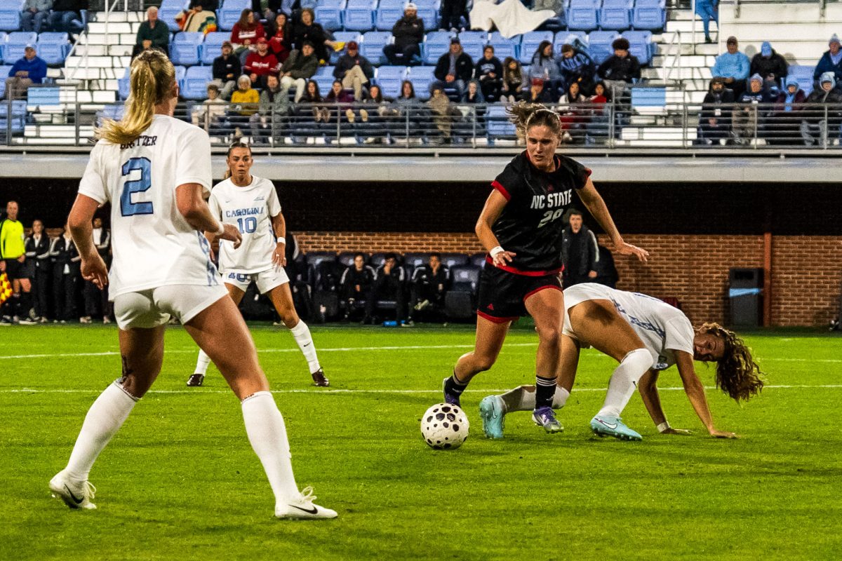 Sophomore midfielder Fien Leijdekker dribbles the ball during the game against UNC in Dorrance Field on Thursday, Oct. 30, 2025. NC State lost to UNC 1-0.