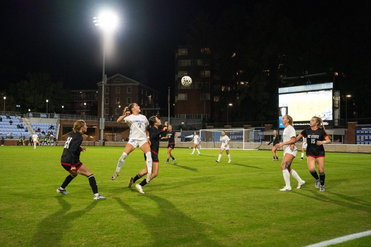 Freshman midfielder Emily Wong watches the ball with her teammates during the game against UNC in Dorrance Field on Thursday, Oct. 30, 2025. NC State lost to UNC 1-0.