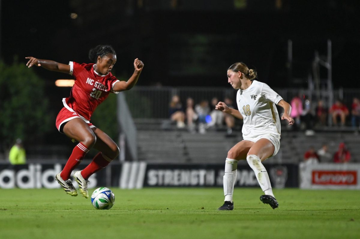 Senior defender Brooklyn Holt defends the ball in game against Wake Forest in Dail Soccer Stadium on Thursday, Oct. 2, 2025. NC State beat Wake Forest 2-1. 