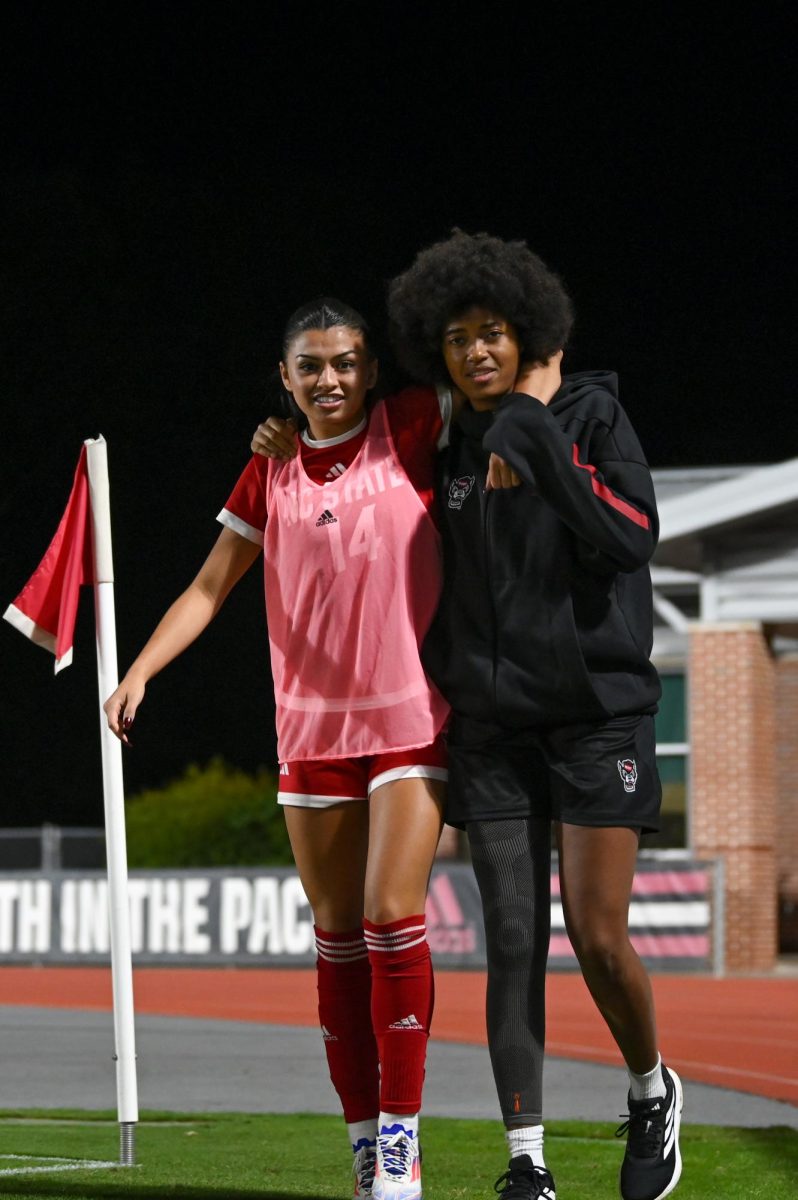 Sophomore forward Maddie Miller and Junior midfielder Rosalie Olou walk back to the game against Wake Forest in Dail Soccer Stadium on Thursday, Oct. 2, 2025. NC State beat Wake Forest 2-1. 