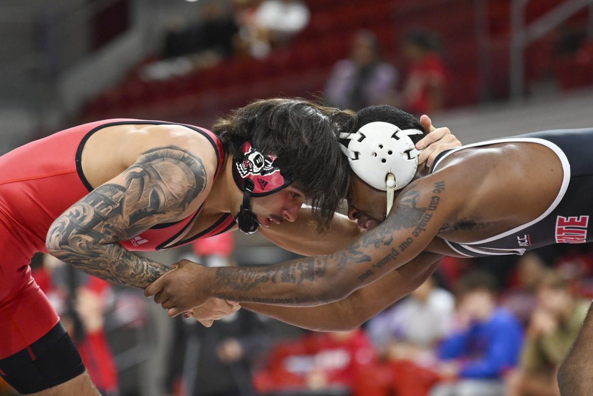 Redshirt freshman Luca Felix and redshirt freshman Jaydon Robinson butt heads during Wrestle-Offs in Reynolds Coliseum on Saturday, Oct. 25, 2025. Wrestle-Offs serves as an exhibition match prior to the wrestling dual season beginning. Felix defeated Robinson in the 149 bout by technical fall 16-0.