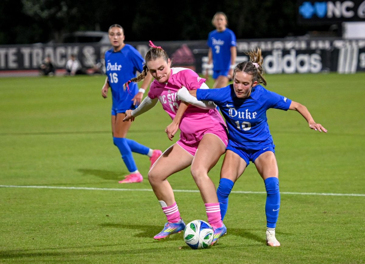 Junior forward Jade Bordeleau battles with her opponent for possession during the game at Dail Soccer Field on Sunday, Oct. 26, 2025. Bordeleau scored one goal. The Blue Devils defeated the Wolfpack 3-1.