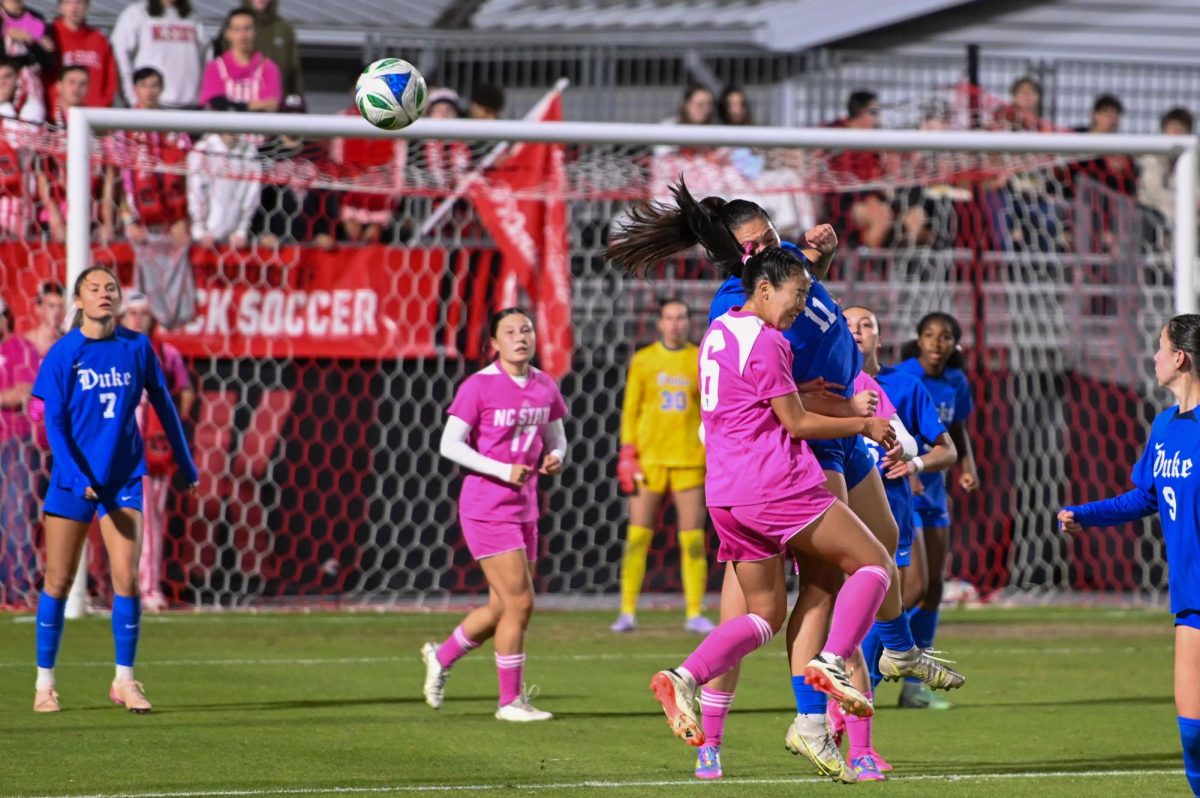Sophomore midfielder Mana Nakata collides in midair with her opponent after going for a header the game at Dail Soccer Field on Sunday, Oct. 26, 2025. Nakata recorded one assist. The Blue Devils defeated the Wolfpack 3-1.