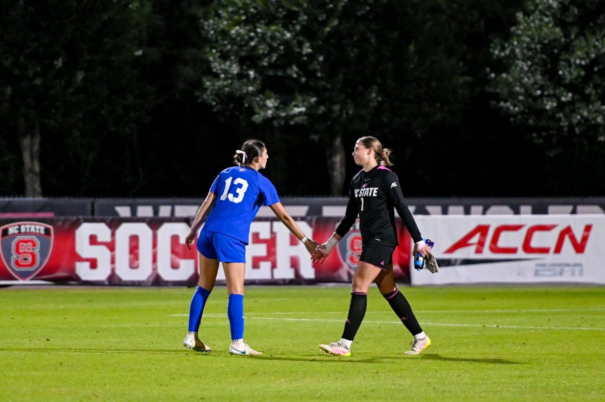 Senior goalkeeper Olivia Pratapas shows sportsmanship after the game at Dail Soccer Field on Sunday, Oct. 26, 2025. Pratapas ended the game with 16 total saves. The Blue Devils defeated the Wolfpack 3-1.