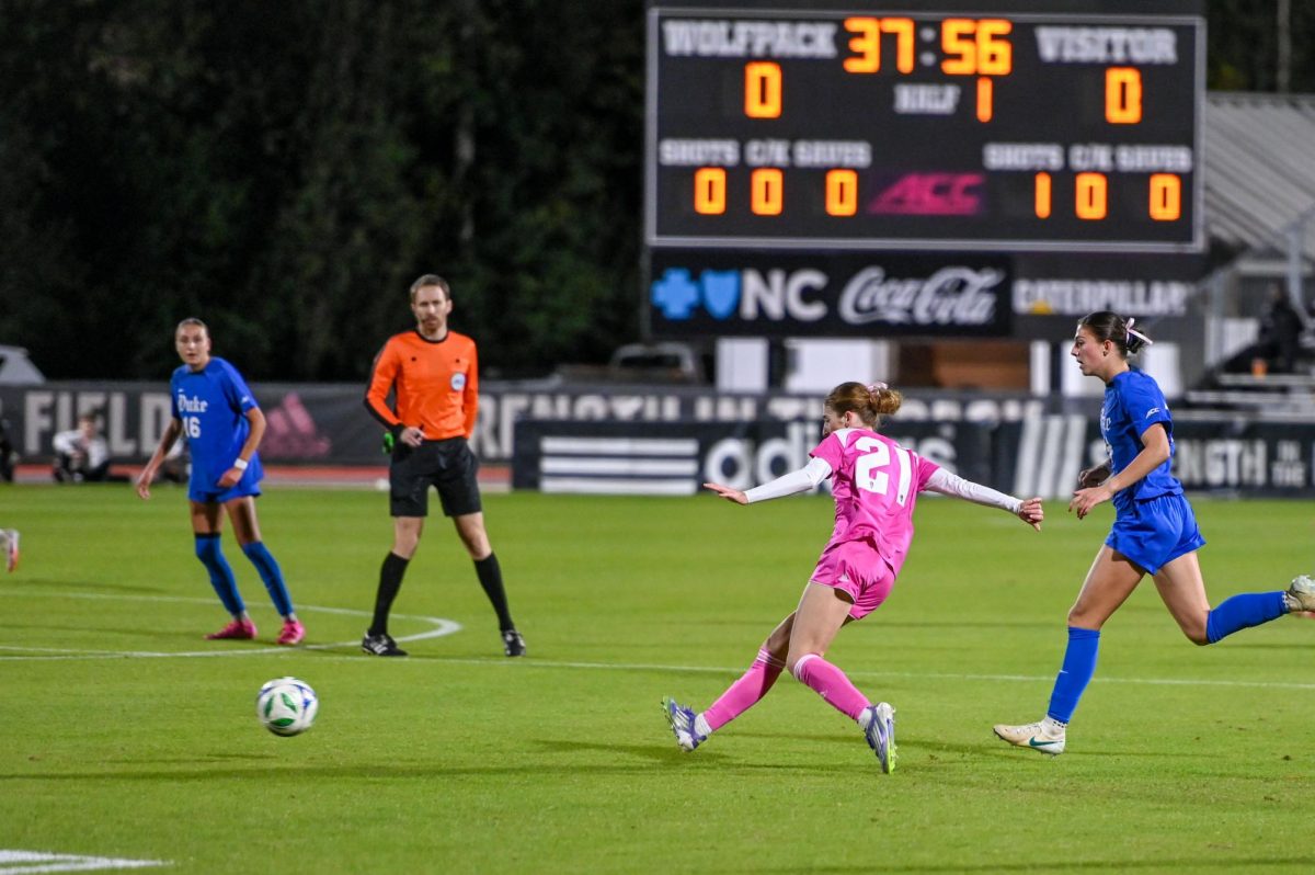 Junior midfielder Mary Frances Symmes sends the ball rolling away during the game at Dail Soccer Field on Sunday, Oct. 26, 2025. The Blue Devils defeated the Wolfpack 3-1.