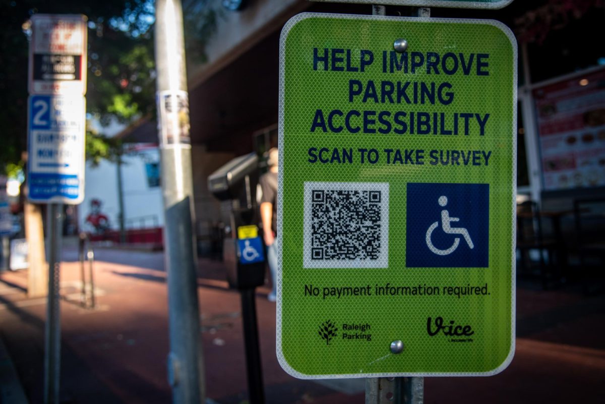 A parking accessibility sign on Hillsborough Street on Monday, Oct. 6, 2025. The City of Raleigh launched the new iAccess online survey tool on June 16, 2025.