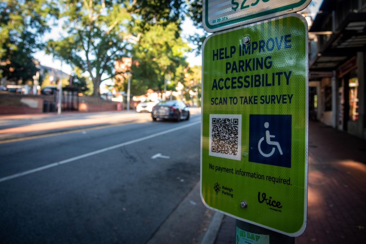 A parking accessibility sign on Hillsborough Street on Monday, Oct. 6, 2025. The City of Raleigh launched the new iAccess online survey tool on June 16, 2025.
