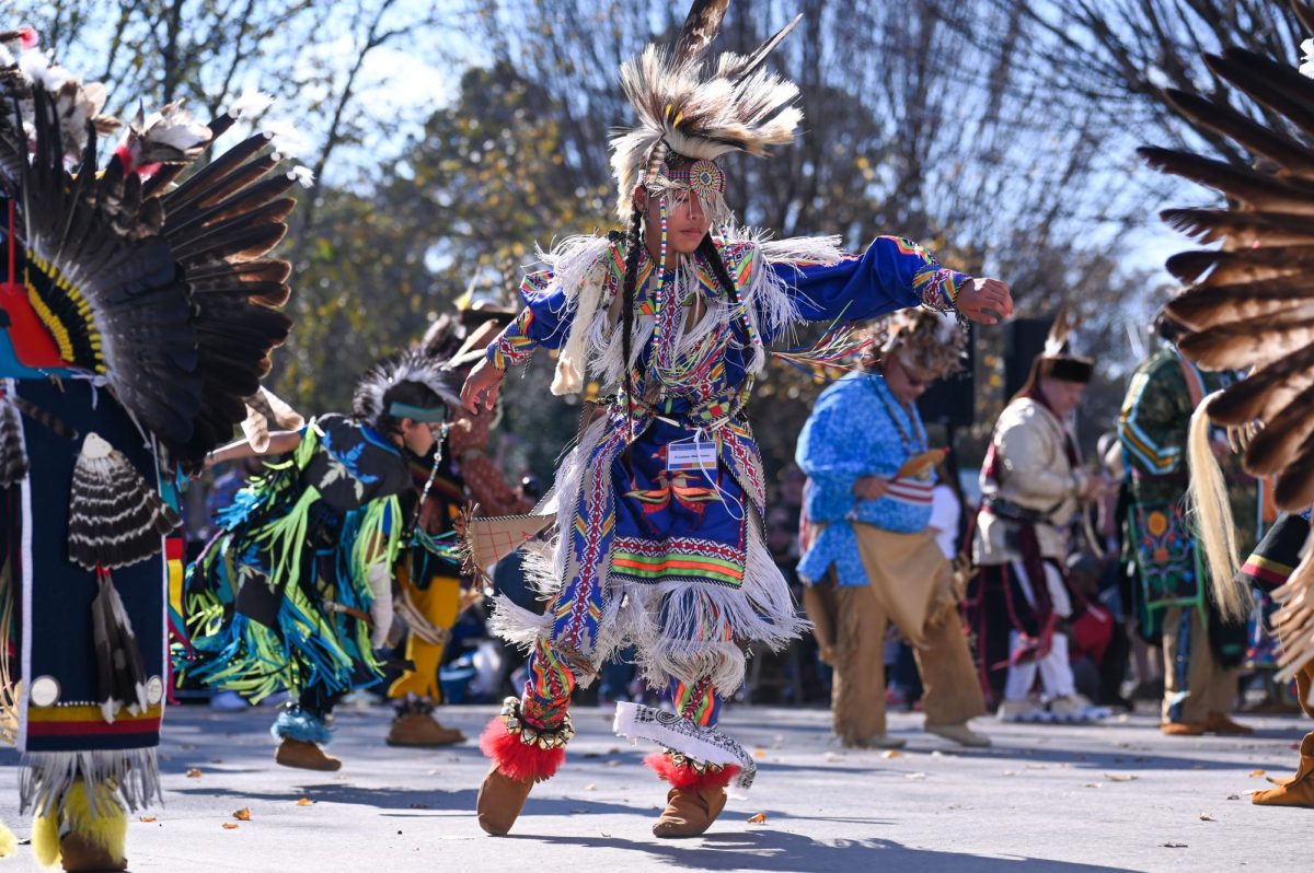 Cristian Martinez dances in the middle of the arena during the 30th Annual American Indian Heritage Celebration at the North Carolina Museum of Art on Saturday, Nov. 22, 2025. This event had a variety of performances, vendors and presentations related to Indigenous culture.