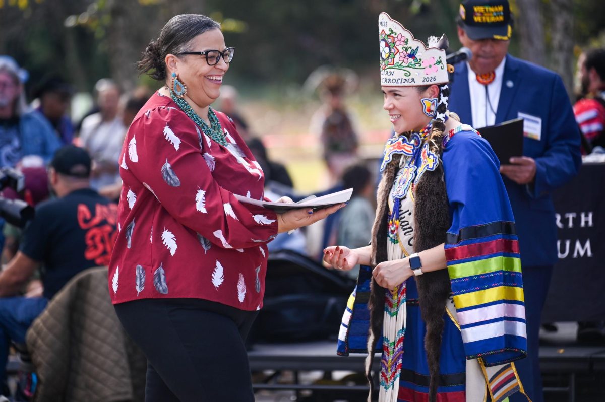 Members of American Indian Tribes in North Carolina recieve a recognition from Josh Stein, handed to them by Page Freeman, named Miss Indian of 2025-2026, during the 30th Annual American Indian Heritage Celebration at the North Carolina Museum of Art on Saturday, Nov. 22, 2025. 