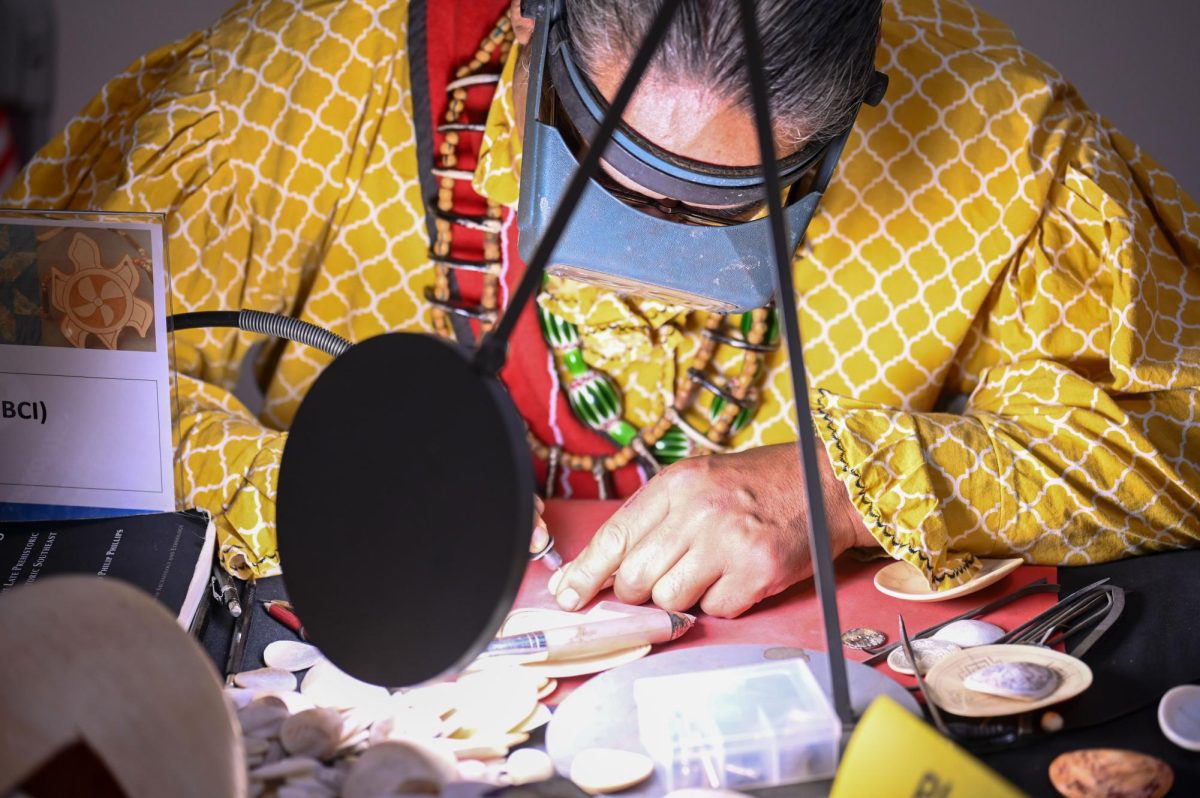 Antonio Grant carves shells during the 30th Annual American Indian Heritage Celebration at the North Carolina Museum of Art on Saturday, Nov. 22, 2025. Various vendors were demonstrating their craft, including basket weaving, quilting and shell carving.