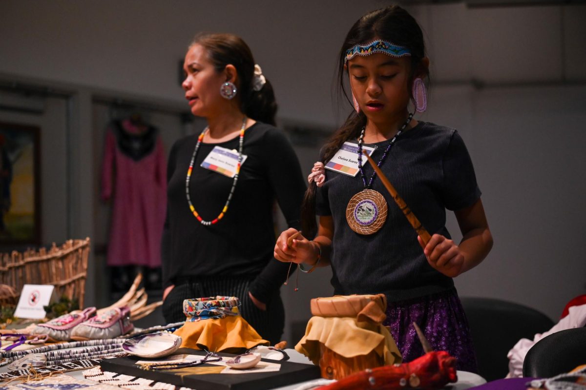 Mary Anne Suarez and Chelsea Suarez sell Indigenous accessories and drums during the 30th Annual American Indian Heritage Celebration at the North Carolina Museum of Art on Saturday, Nov. 22, 2025. 