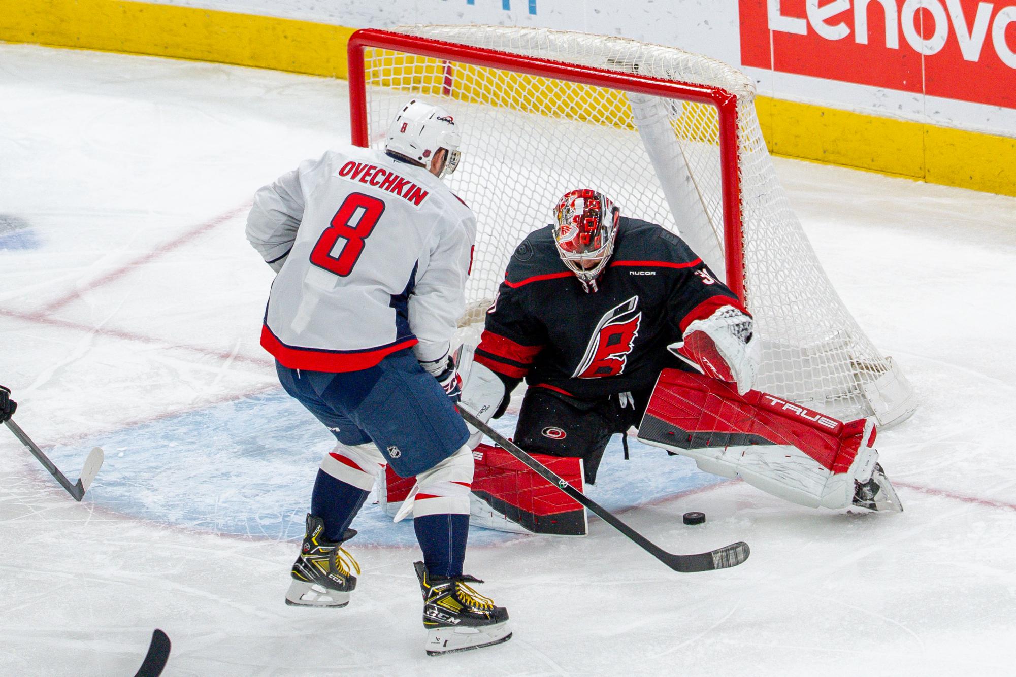 Goaltender Frederik Andersen attempts to save the puck during the game against the Washington Capitals at the Lenovo Center on Tuesday, Nov. 11, 2025. Andersen accumulated 27 saves. The Capitals beat the Canes 4-1.