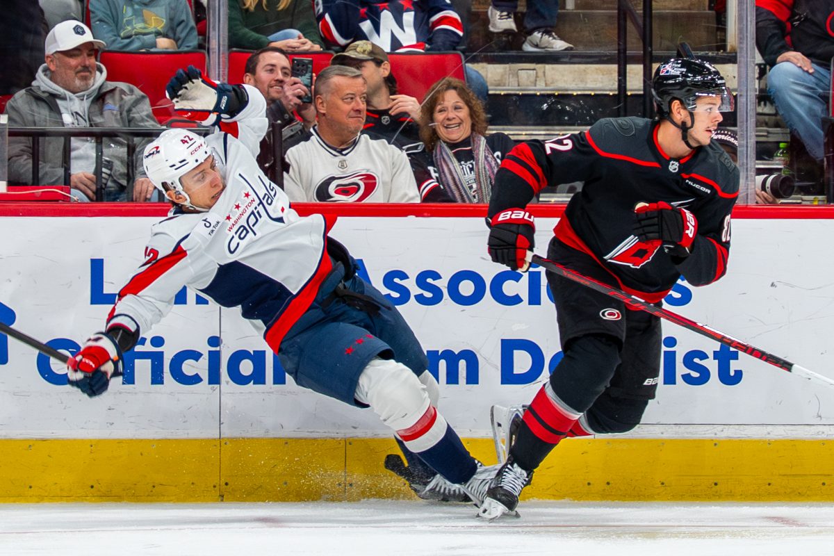 Forward Sebastian Aho trips his opponent during the game against the Washington Capitals at the Lenovo Center on Tuesday, Nov. 11, 2025. Aho had zero shots on goal. The Capitals beat the Canes 4-1.