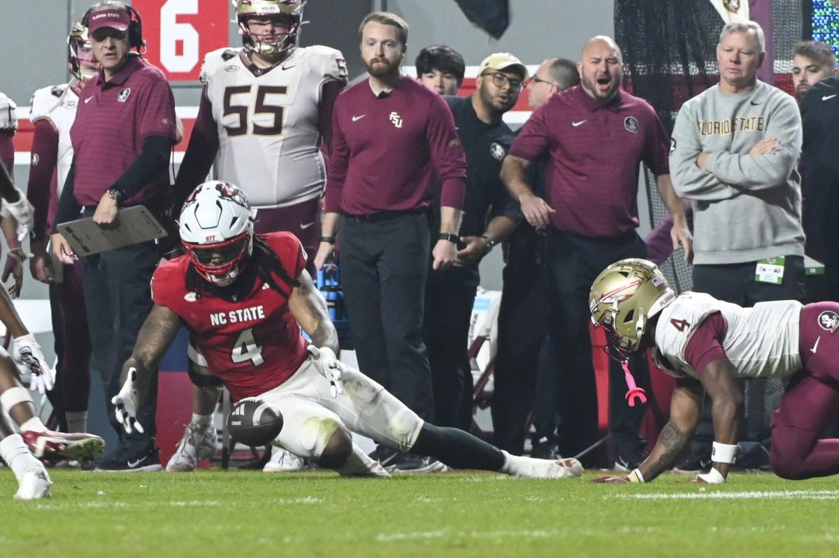 Graduate linebacker Tra Thomas goes to catch the fumble during the football game against Florida State in Carter-Finley Stadium on Friday, Nov. 21, 2025. NC State beat FSU 21-11.