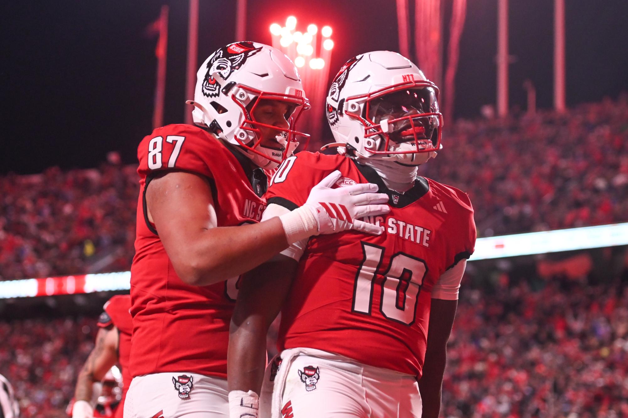 Redshirt senior tight end Dante Daniels and freshman quarterback Will Wilson celebrates a touchdown during the game against UNC-Chapel Hill at Carter-Finley Stadium on Saturday, Nov. 29, 2025. Wilson scored a total of four touchdowns. NC State beat UNC 42-19.
