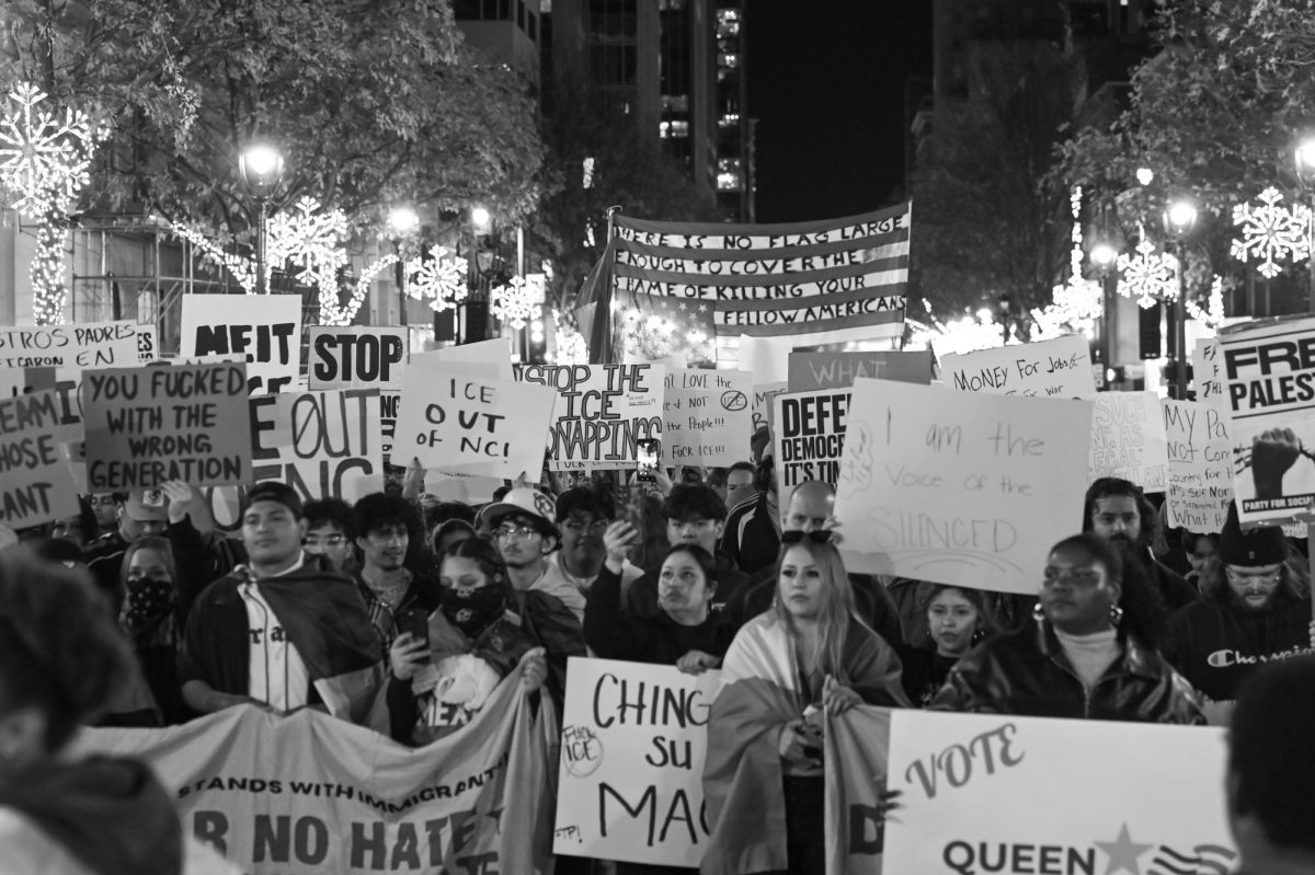 ICE protesters march with several signs in downtown Raleigh during the "No Border Patrol in Raleigh" protest on Tuesday, Nov. 18, 2025. Hundreds of members and organizations of the Research Triangle community gathered to protest the ICE raids.