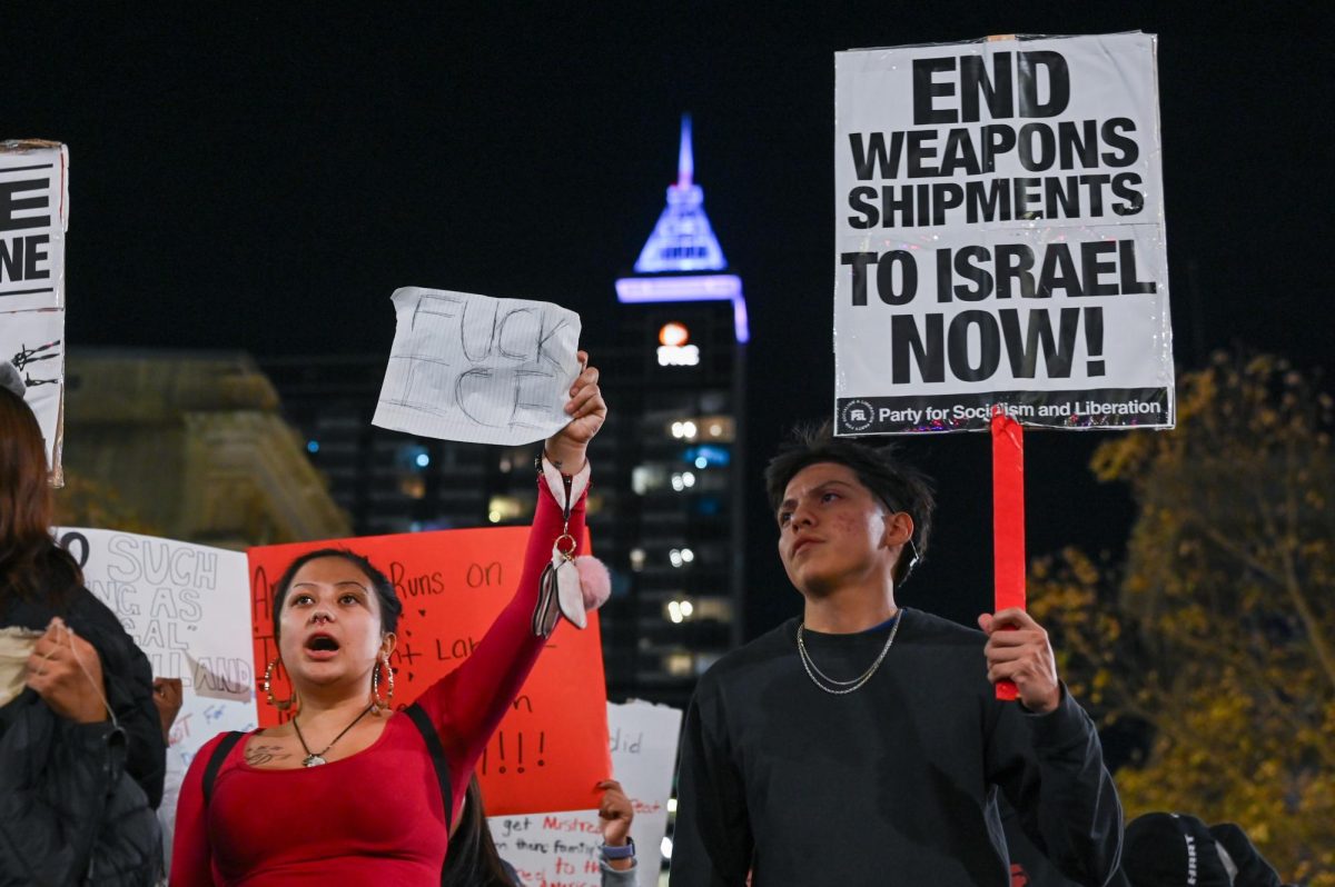 Protesters march and chant with their banners in downtown Raleigh during the "No Border Patrol in Raleigh" protest on Tuesday, Nov. 18, 2025. Hundreds of members and organizations of the Research Triangle community gathered to protest the ICE raids.