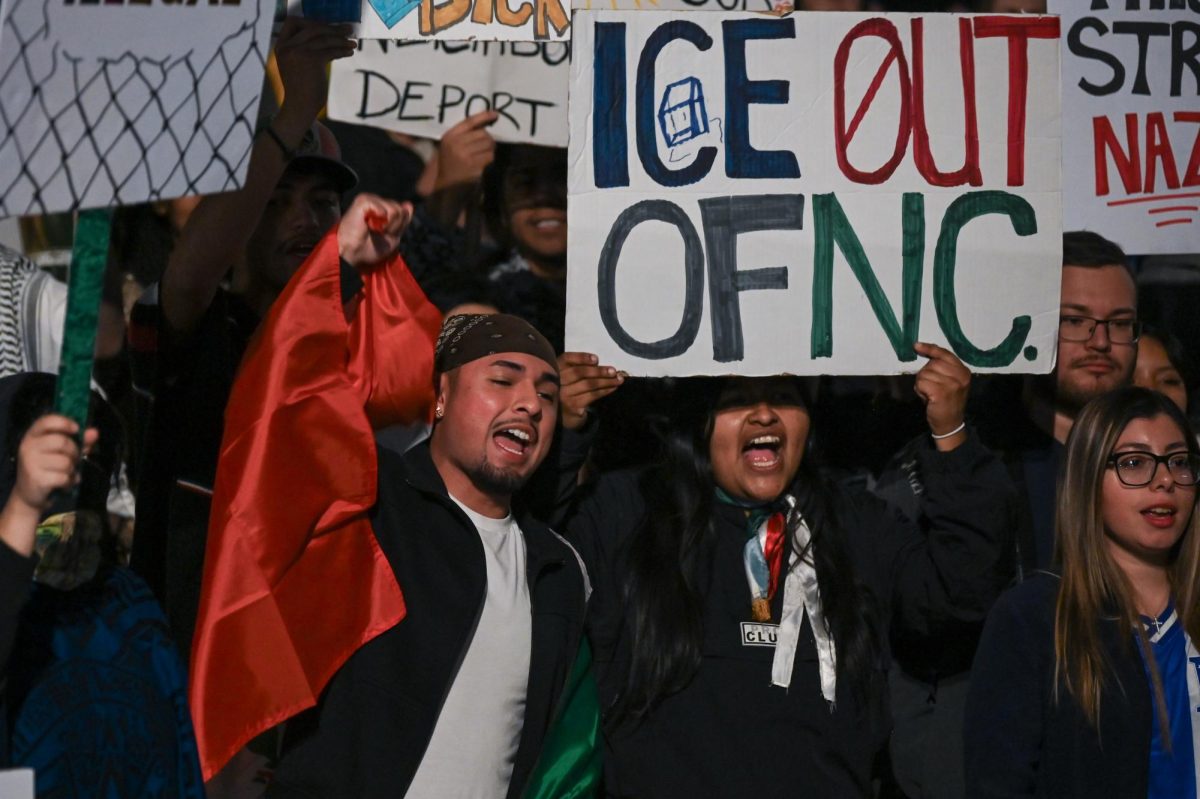 David Suarez, a fourth-year in construction engineering and President of Gamma Sigma Chapter of Lambda Theta Phi Latin Fraternity Inc. chants during the "No Border Patrol in Raleigh" protest in Downtown Raleigh on Tuesday, Nov. 18, 2025. The protest was organized by the social organizations Party For Socialism and Liberation, Nuestro Barrio Cafe, PalyYouthNC and 50501NC.