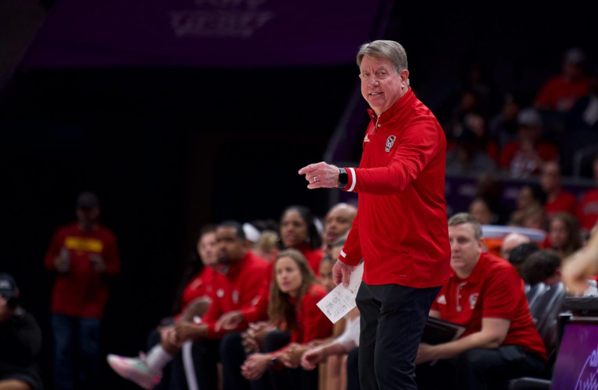 Head coach Wes Moore points during the game against USC in the Spectrum Center on Sunday, Nov. 9, 2025. NC State fell to the Trojans 69-68.