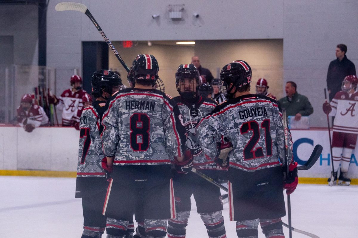 The Icepack huddles up in a timeout during the game at Invisalign Arena on Friday, Nov. 14,  2025. NC State defeated Alabama 4-3.