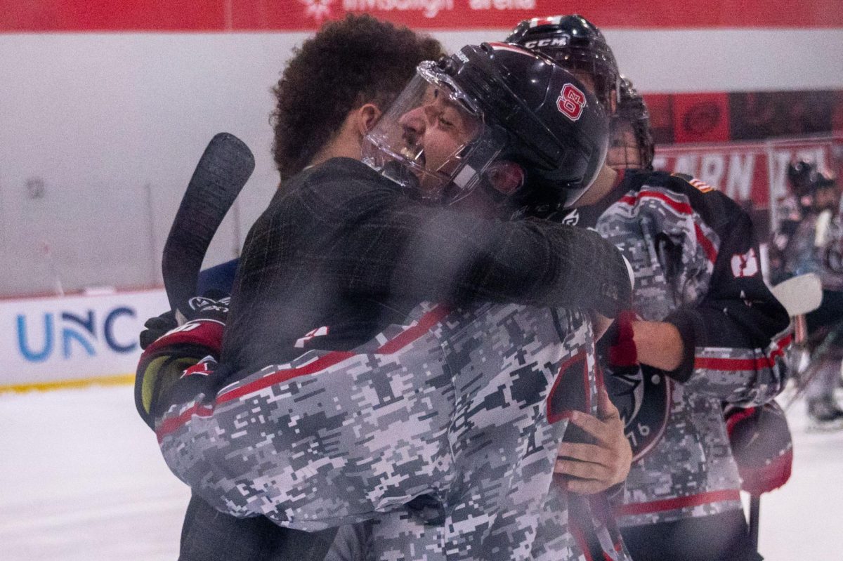 Senior defenseman Nicholas Librizzi embraces a friend after the game at Invisalign Arena on Friday, Nov. 14,  2025. NC State defeated Alabama 4-3.