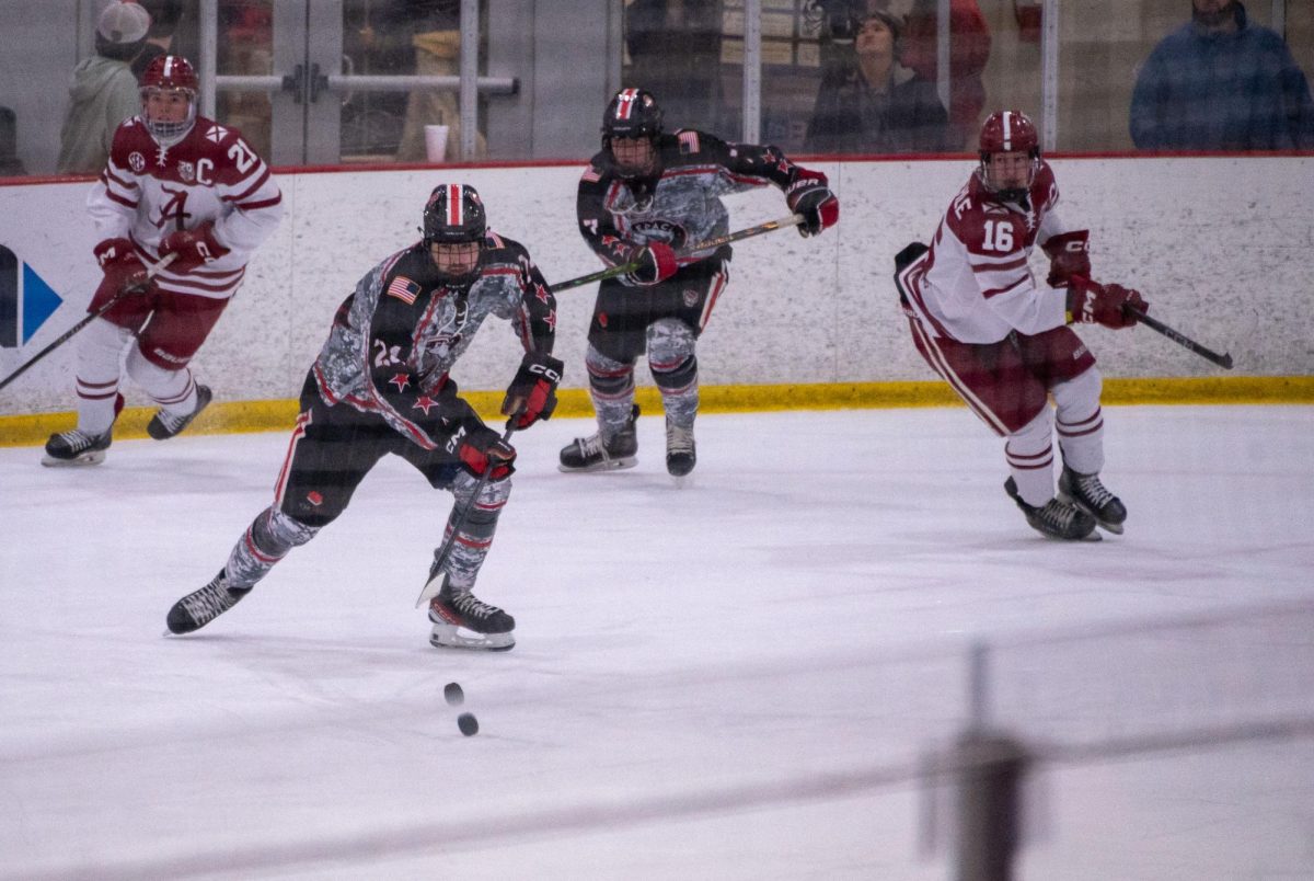 Sophomore forward Jake Lipani zeroes in on the puck during the game at Invisalign Arena on Friday, Nov. 14,  2025. NC State defeated Alabama 4-3.