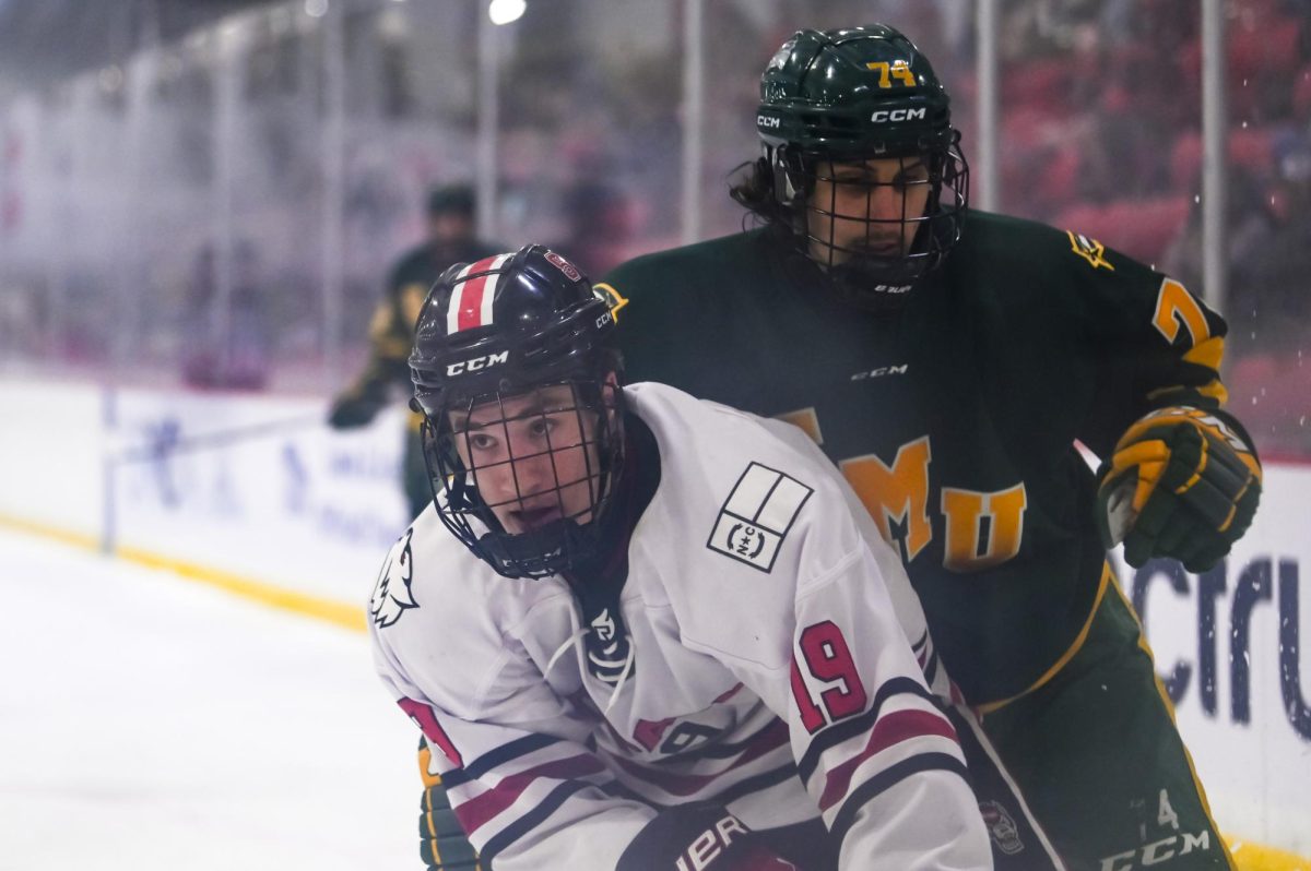 Freshman forward Jack Ammons dodges an opponent during the game against George Mason at Invisalign Arena on Friday, Nov. 21, 2025. Ammons scored one goal during the game. NC State lost to George Mason 3-1.