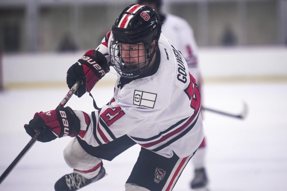 Senior forward Joey Gouveia shoots the puck during the game against George Mason at Invisalign Arena on Friday, Nov. 21, 2025. Gouveia has had 4 goals this season. NC State lost to George Mason 3-1.
