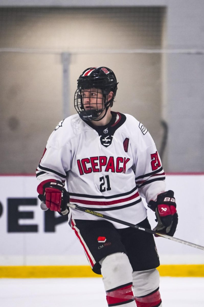 Senior forward Joey Gouveia skates towards his teammates during the game against George Mason at Invisalign Arena on Friday, Nov. 21, 2025. Gouveia has played in 17 games this season. NC State lost to George Mason 3-1.