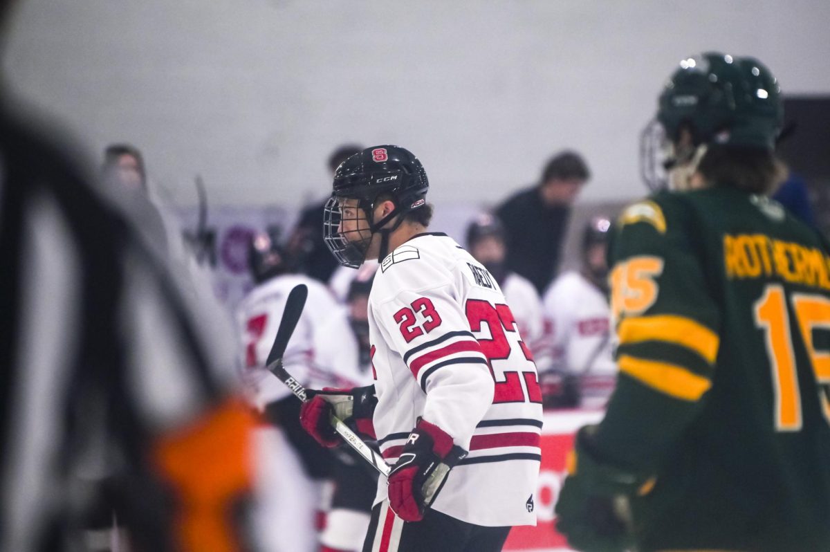 Freshman forward Aidan Raedy watches his teammates during the game against George Mason at Invisalign Arena on Friday, Nov. 21, 2025. Raedy has played in 14 games this season. NC State lost to George Mason 3-1.