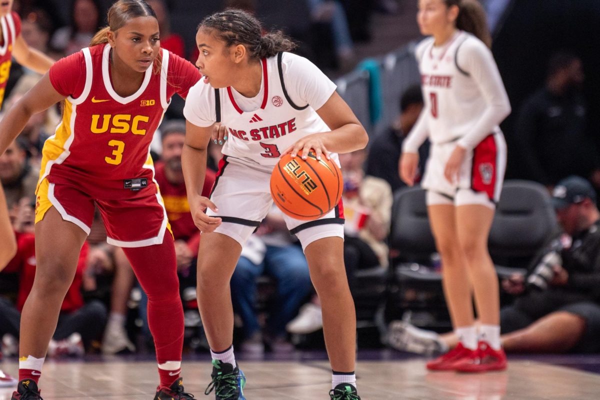 Sophomore guard Zamareya Jones dribbles the ball during the game against USC at the Spectrum Center on Sunday, Nov. 9, 2025. Jones had one rebound. NC State lost to USC 69-68. 