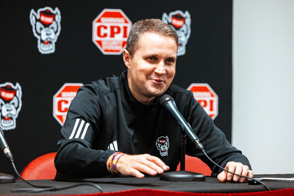 Head coach Will Wade smiles during the postgame press conference after the game against North Carolina Central at the Lenovo Center on Monday, Nov. 3, 2025. The Wolfpack defeated the Eagles 114-66.