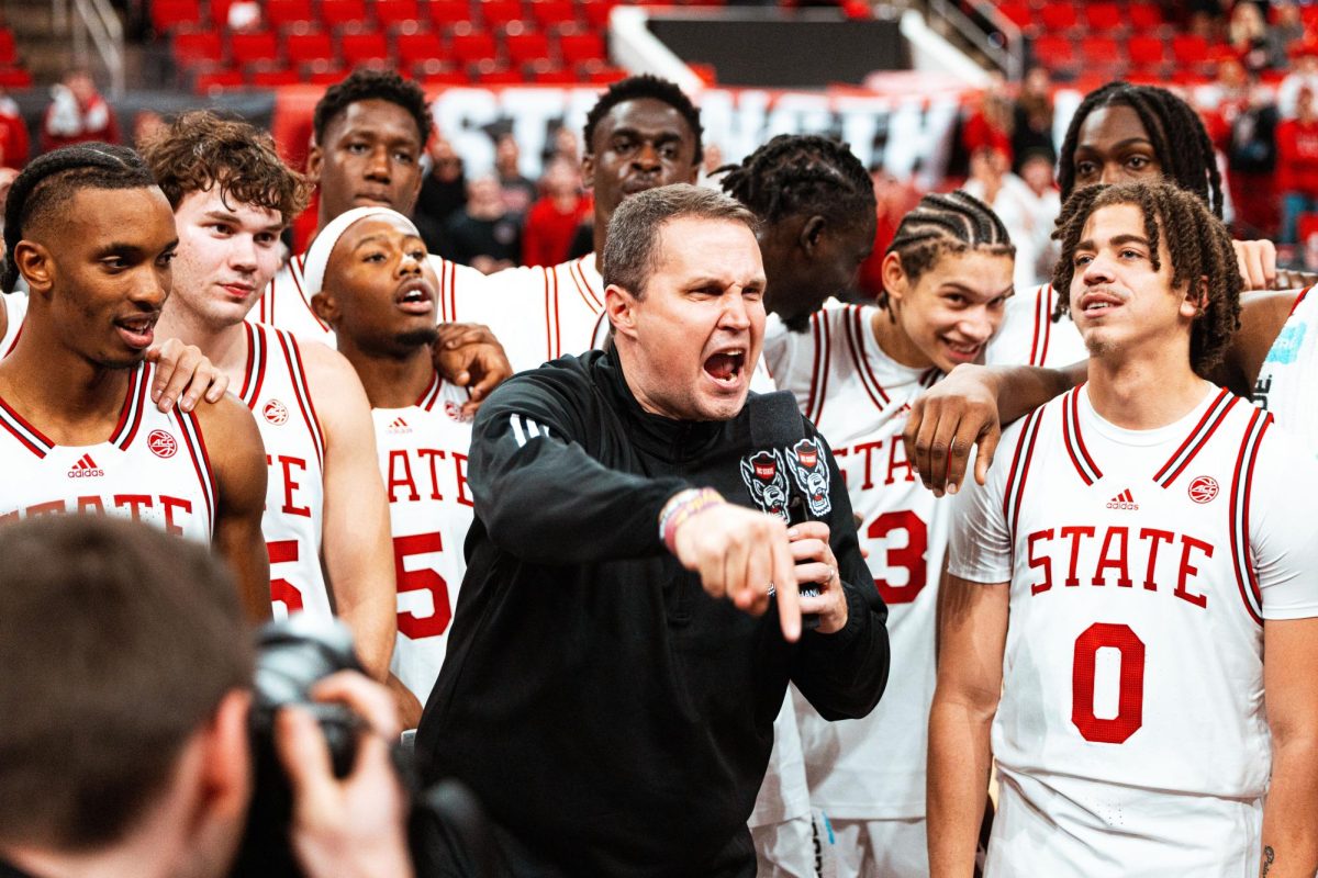 Will Wade hypes up the crowd after his first win as NC State head coach after the game against North Carolina Central in the Lenovo Center on Monday, Nov. 3, 2025. The Wolfpack defeated the Eagles 114-66.