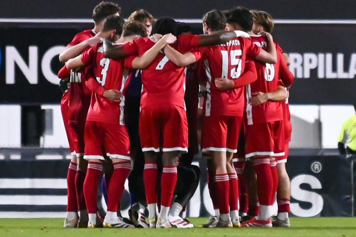The teams hugs during the game against Louisville at Dail Soccer Stadium on Wednesday, Nov. 24, 2025. The Wolfpack defeated the Cardinals 3-0.