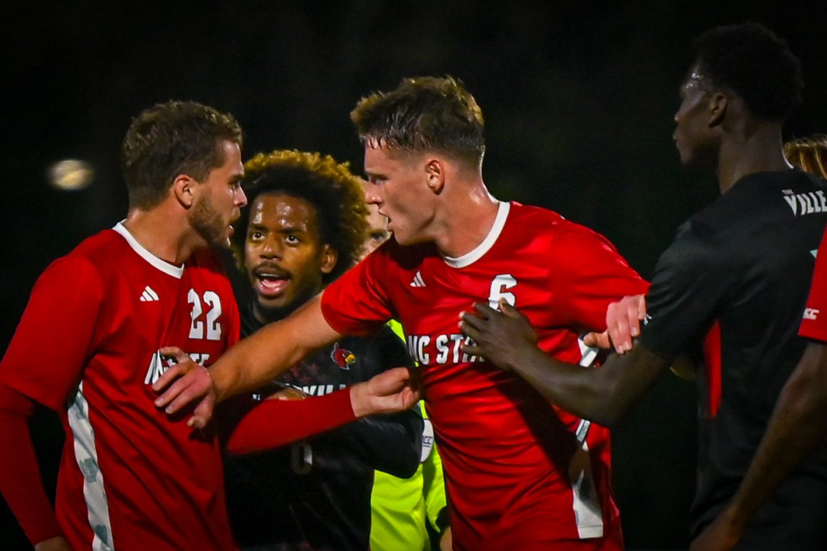 Sophomore defense Nikola Markocvic breaks up a fight during the game against Louisville at Dail Soccer Stadium on Wednesday, Nov. 24, 2025. The Wolfpack defeated the Cardinals 3-0.