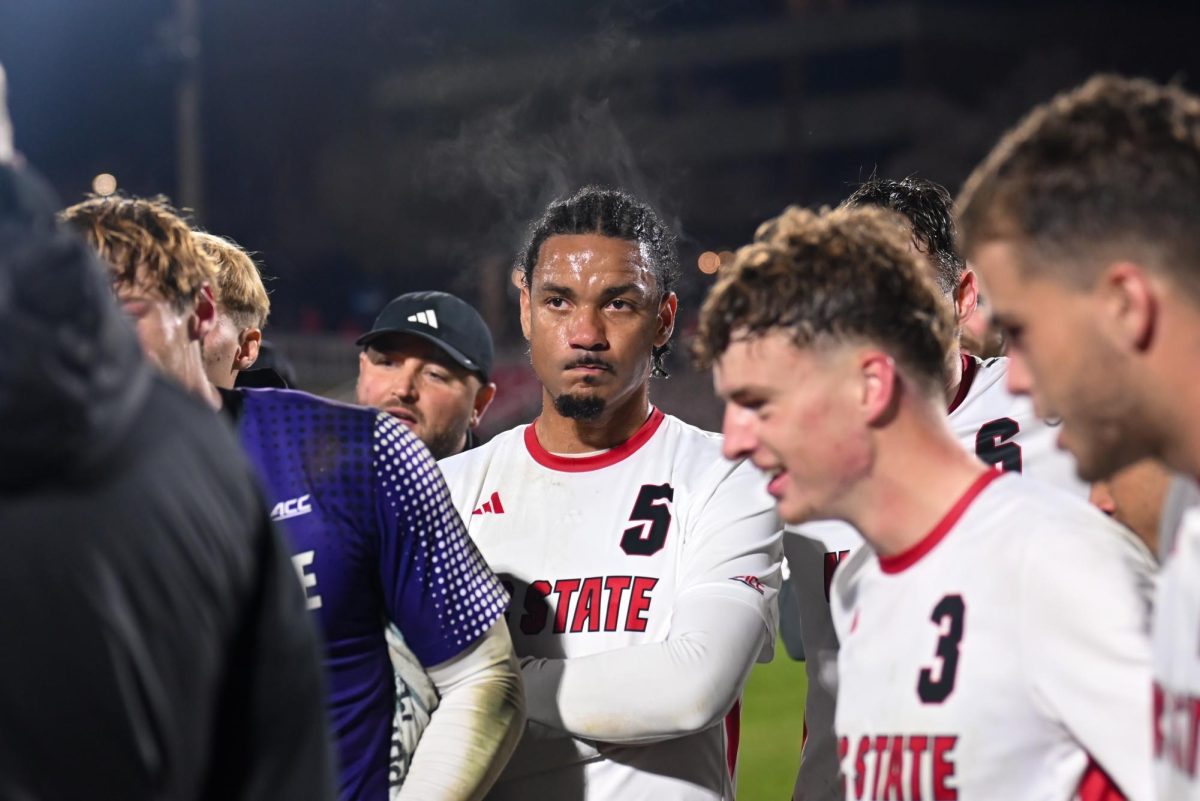 Fifth-year midfielder Thomas Lamaille listens in the huddle after the game against Marshall at Dail Soccer Field on Sunday, Nov. 23, 2025. NC State beat Marshall 2-0.