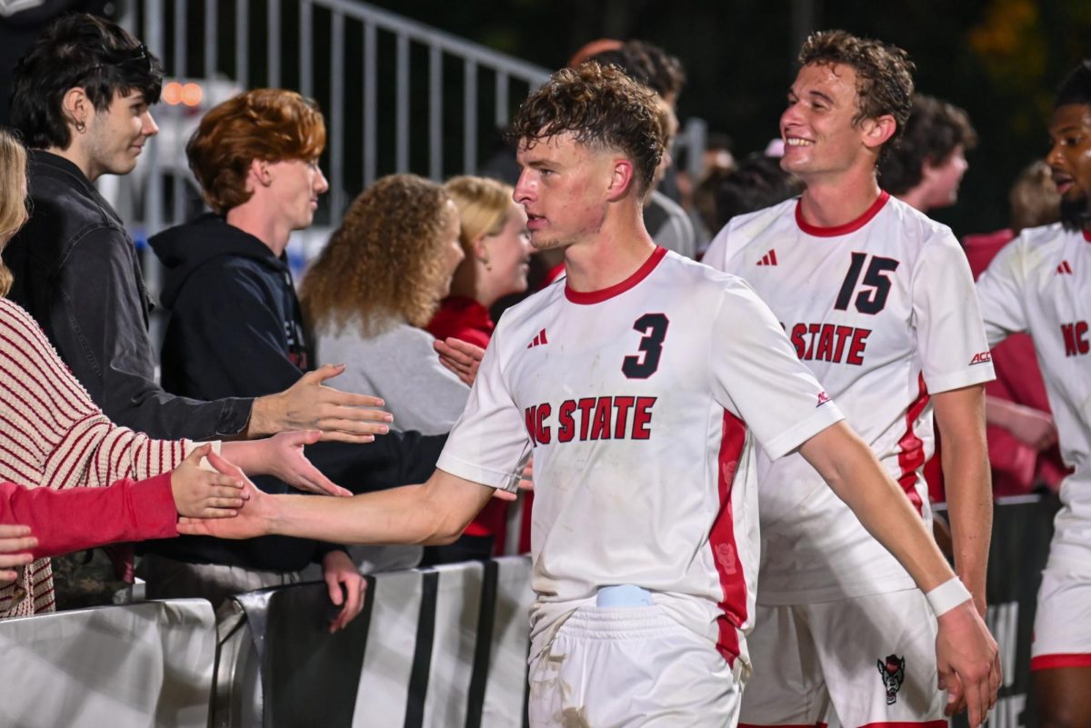 Freshman defender Riley Moloney high-fives members of the Red Terrors after the game against Marshall at Dail Soccer Field on Sunday, Nov. 23, 2025. Moloney recorded one goal and one assist. NC State beat Marshall 2-0.