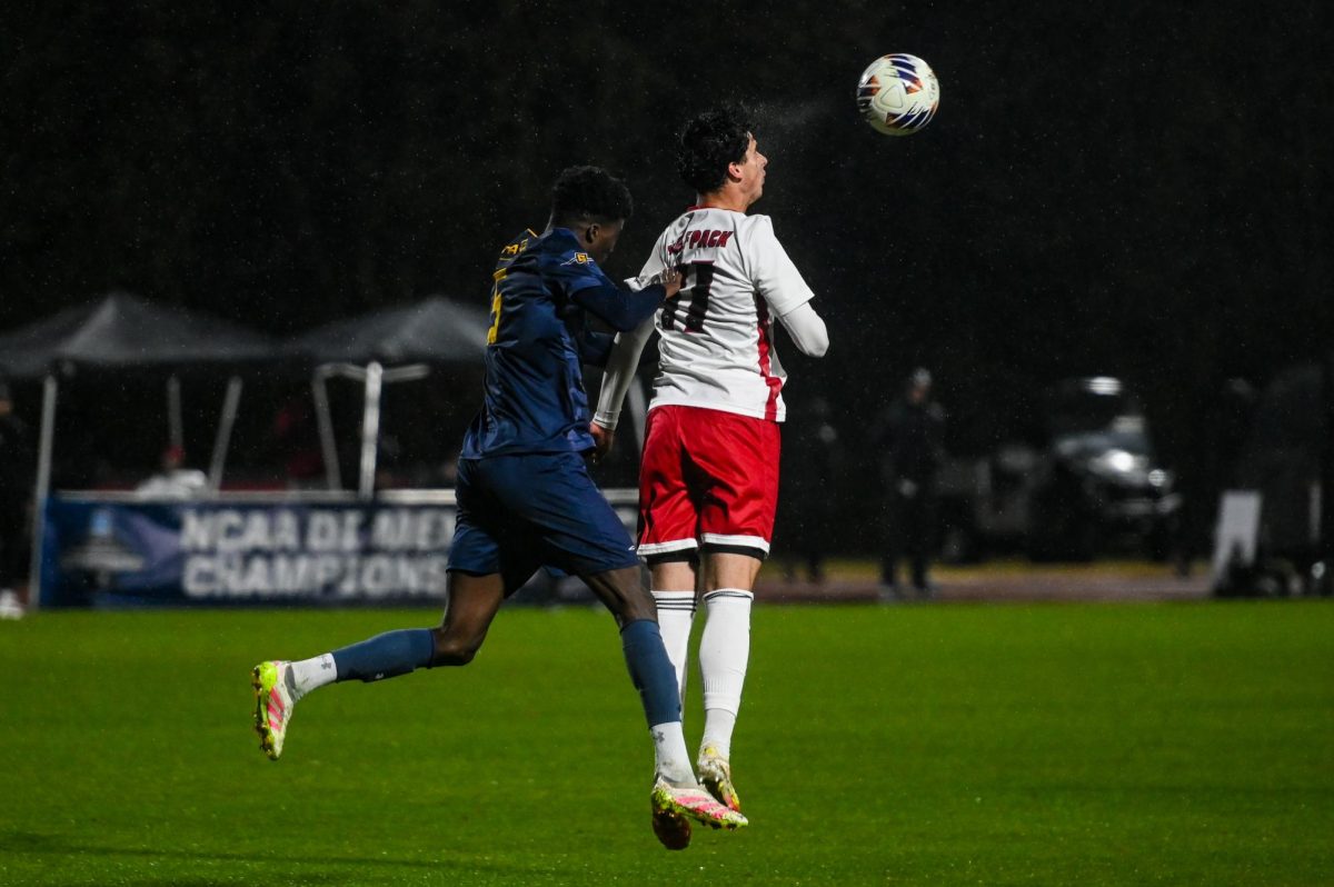 Sophomore forward Frankie DeFrancesco heads the ball during the game against UNCG in Dail Soccer Stadium on Sunday, Nov. 30, 2025. The Wolfpack defeated the Spartans 2-0.