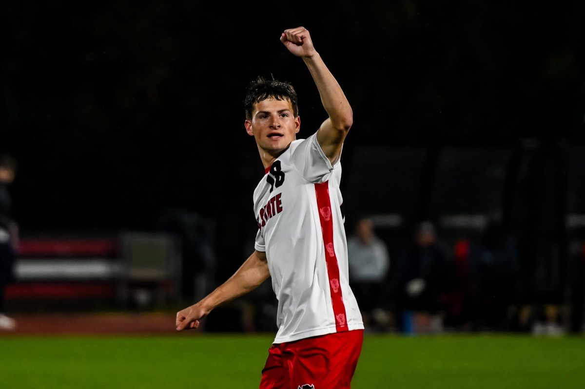Redshirt junior defender Isaac Heffess makes a fist to the crowd during the game against UNCG in Dail Soccer Stadium on Sunday, Nov. 30, 2025. The Wolfpack defeated the Spartans 2-0 to advance to the quarterfinals of the NCAA Soccer Tournament.