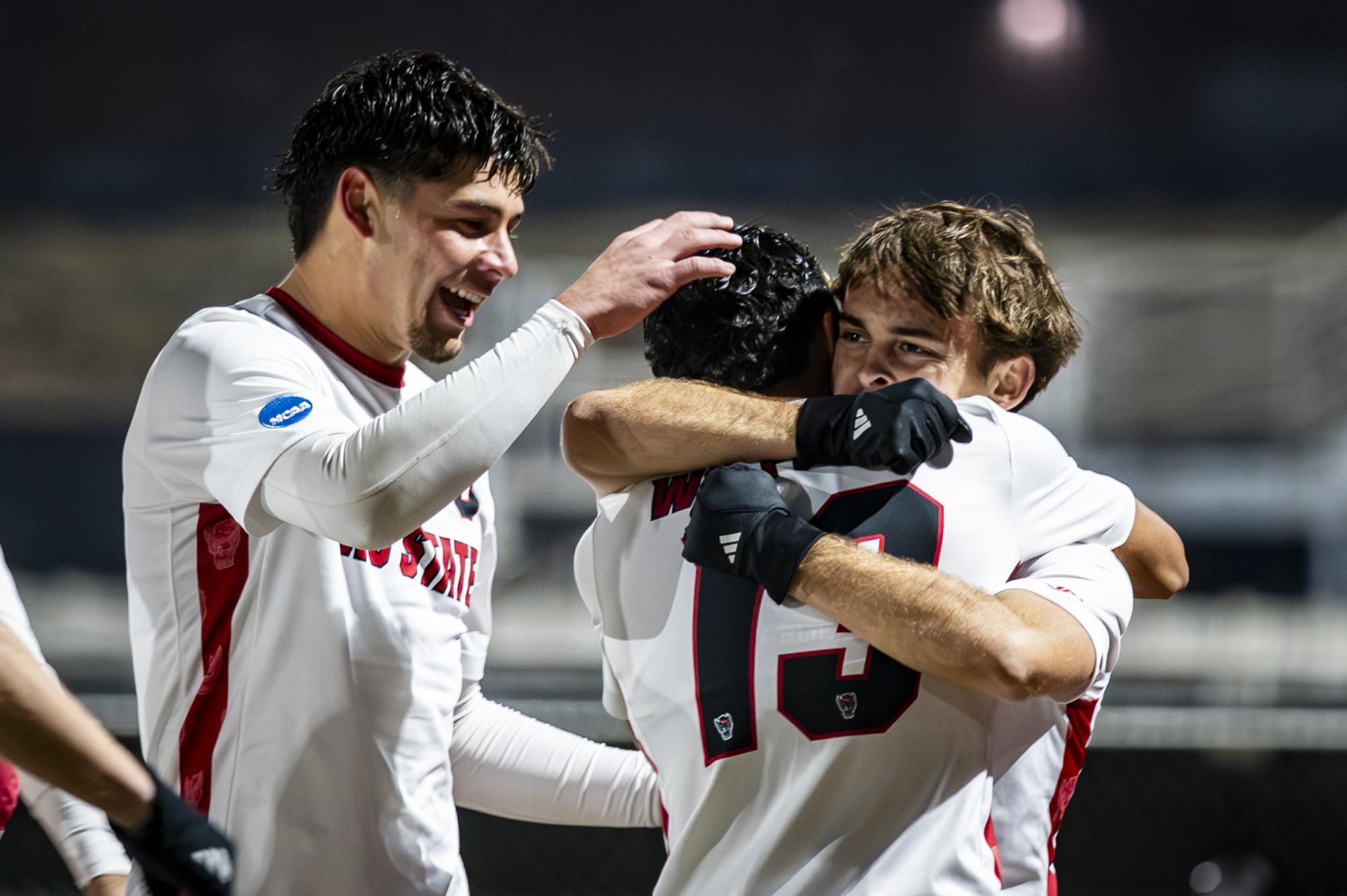 Senior midfielder Taig Healy hugs senior defender Calem Tommy while celebrating after a goal during the game against UNCG at Dail Soccer Stadium on Sunday, Nov. 30, 2025. The Wolfpack defeated the Spartans 2-0.