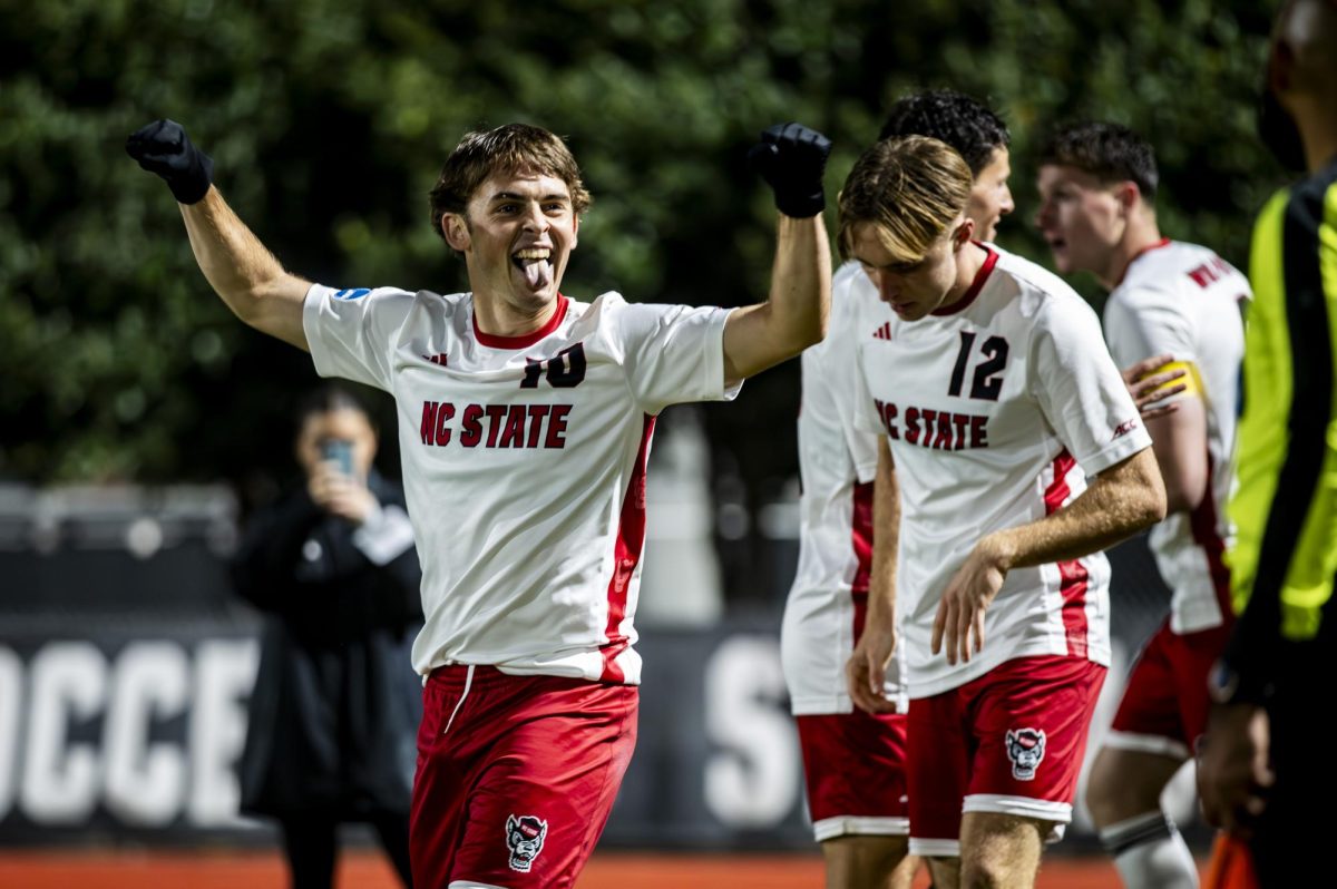 Senior midfielder Taig Healy celebrates with the crowd after a goal during the game against UNCG at Dail Soccer Stadium on Sunday, Nov. 30, 2025. The Wolfpack defeated the Spartans 2-0.