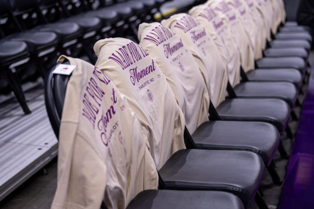 "Made For The Moment" shirts line the seats before the game against USC at the Spectrum Center on Sunday, Nov. 9, 2025. The Wolfpack fell to the Trojans 69-68. 