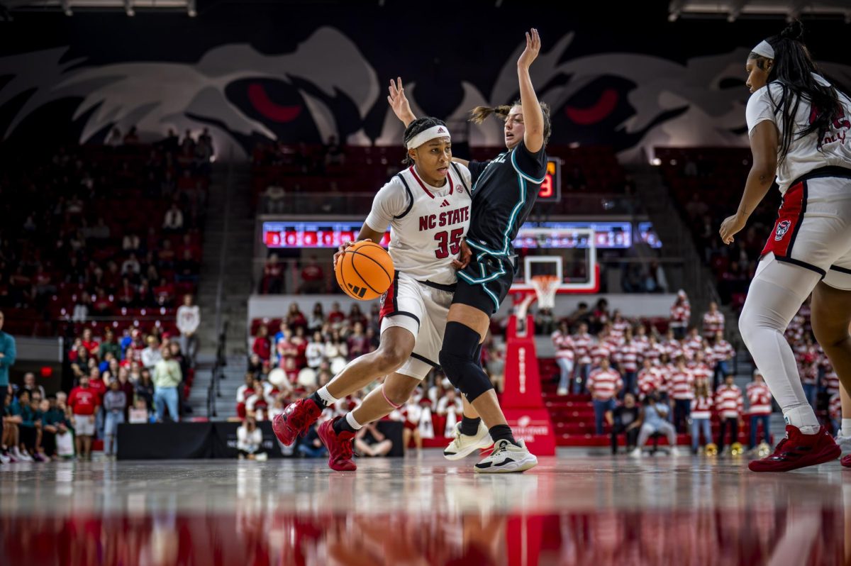 Junior guard Zoe Brooks drives to the basket during the game against Coastal Carolina in Reynolds Coliseum on Wednesday, Nov. 19, 2025. Brooks scored 13 points. The Wolfpack defeated the Chanticleers 71-58.